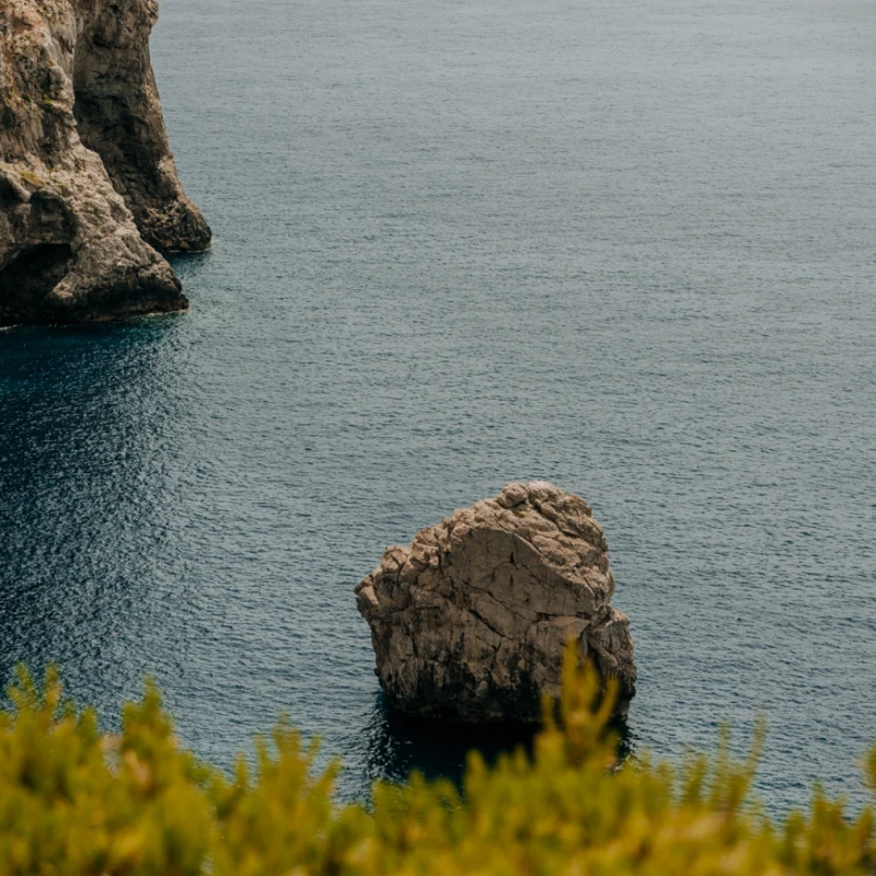 A view of a rock in the sea